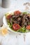 Salad with turkey liver, mushrooms and red oranges