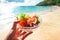 Salad vegetable on hand and sea coast background - salad shrimp with fruit and fresh lettuce tomato carrot bell pepper on bowl