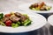 Salad with warm veal and vegetables