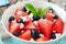 Salad with watermelon, blueberries and feta, cheese close up