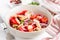 Salad with white beans, tomatoes, red onions, green coriander, p