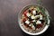 Salad of whole grain cereal spelt with feta cheese, cherry tomatoes and oregano.
