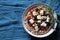 Salad of whole grain cereal spelt with feta cheese, cherry tomatoes and oregano.