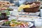 Salads and buns on table