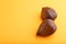 Salak or snake fruit on orange pastel background. Side view, copy space