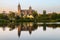 Salamanca Old and New Cathedrales reflected on Tormes River at sunset, Spain