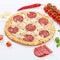Salami pizza square ingredients on wooden board