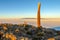 Salar de Uyuni salt plains with large cactuses of island Incahuasi at sunrise time, Andean Altiplano, Bolivia, South