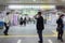A salaryman is standing and he`s wearing a mask avoiding transmittion any virus like Coronavirus
