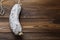 Salchichon sausage on light wooden background with copy space