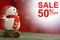 Sale 50% Christmas Snowman on bokeh background.