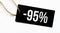 SALE 95 percents text on a black tag on a white paper background