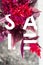 Sale banner. Letters in flowers. Modern stylish solution for you design. Red . White