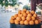 Sale of big fresh natural organic oranges on the city street. Citrus harvesting season. Making of orange fresh juice on