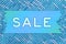 Sale blue wood sign on blue and white sparkle ribbon