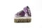 .Sale Concept - Children`s sparkling little sneakers on wooden cubes