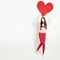 Sale Concept. Fashion Woman holding Big Red Banner Heart