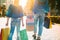 sale, consumerism, money and people concept - happy young woman with shopping bags and credit card in mall