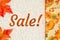 Sale message with a red and orange fall leaves border autumn