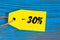 Sale minus 30 percent. Big sales thirty percents on blue wooden background for flyer, poster, shopping, sign, discount