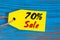 Sale minus 70 percent. Big sales seventy percents on blue wooden background for flyer, poster, shopping, sign, discount