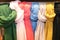 Sale of Multi-color silk shawls scarf in hanger in shop