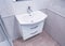 Sale of a new and modern designer hand washbasin with drawers in the bathroom. Background, bathroom furniture