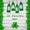 Sale poster of Saint Patrick`s day with emerald shamrocks on light wooden background and hanging green tags. Vector illustration