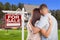 For Sale Real Estate Sign, Military Couple Looking at House