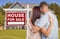 For Sale Real Estate Sign, Military Couple Looking at House