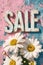 \\\'SALE\\\' sign on a rustic blue wall with white daisies