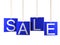 Sale tag on blue hanging labels