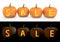 Sale text carved on pumpkin jack lantern