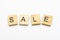 Sale word on scrabble wooden tiles