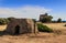 SALENTO LANDSCAPE.Trullo house:in the background Uluzzo watchtower .Apulia,Italy.