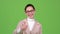 Sales agent advertises the product and shows a thumbs up. Green screen