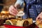 Sales Assistant In Bakery Putting Vegetarian Label Into Freshly Baked Baked Savoury Roll