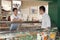 Sales Clerk assisting man at the Deli counter, Beijing