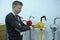 Sales manager shows Rotary hand pumps placed on stand