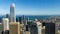 Salesforce tower and surrounding buildings on a summer day