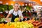 Salesgirl at her first job in vegetable shop