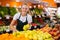 Salesgirl at her first job in vegetable shop