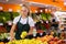 Salesgirl at her first job in vegetable shop