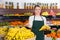 Salesgirl proposing bananas