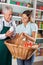 Salesman Assisting Customer Buying Groceries