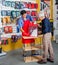 Salesman Assisting Man In Buying Tools At Store