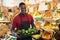 Salesman carrying box with green peppers