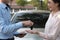 Salesman give car key to customer. woman buying car from dealer.