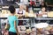 Salesman Giving Cheese To Female Customer At Counter