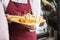 Salesman Holding Cutting Board With Assorted Cheese